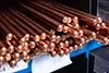 Copper rods on a shelf